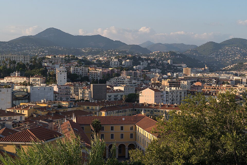 Rooftops of Nice with hills beyond