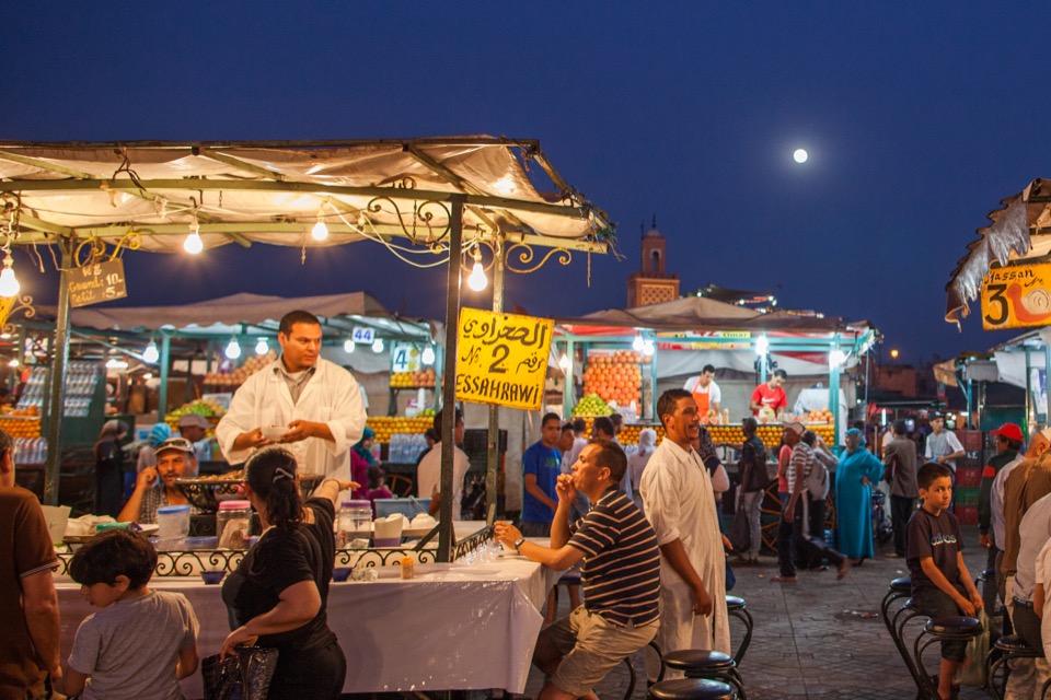 Food stalls and diners in Jemaa el-Fna square at night, Marrakesh.